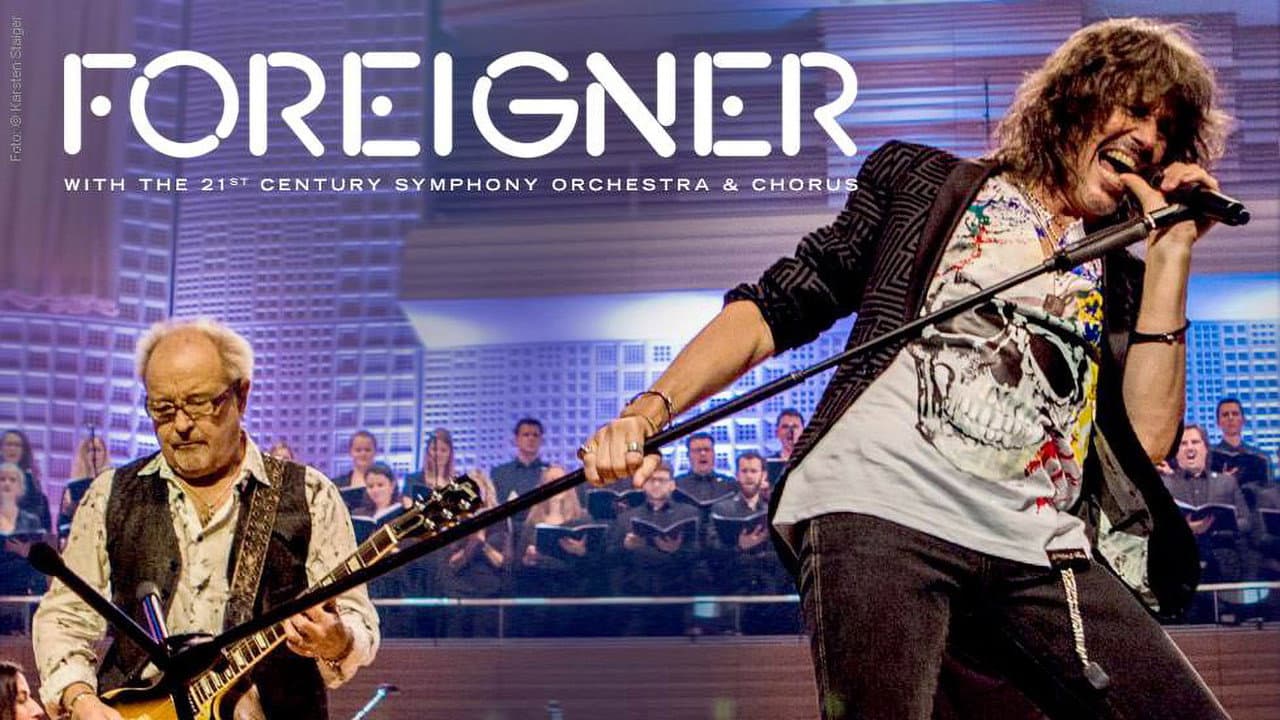 Szene aus Foreigner with the 21st Century Symphony Orchestra and Chorus